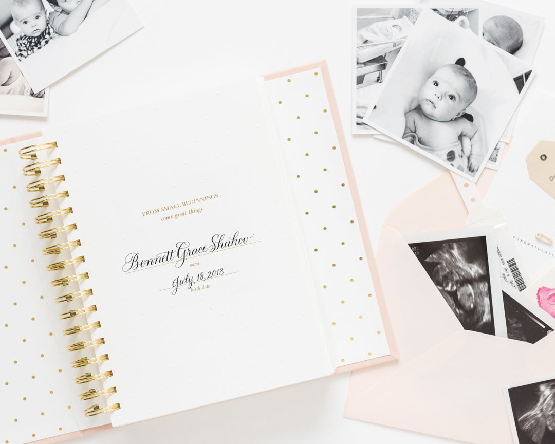 interior page of baby book with baby's name and birthdate