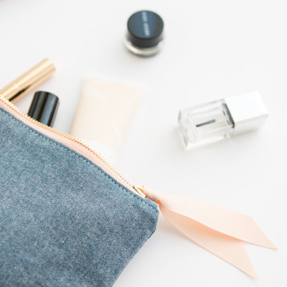 chambray pouch with toiletries