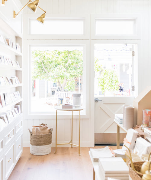 Close up of shop window featuring dutch door and merchandising display