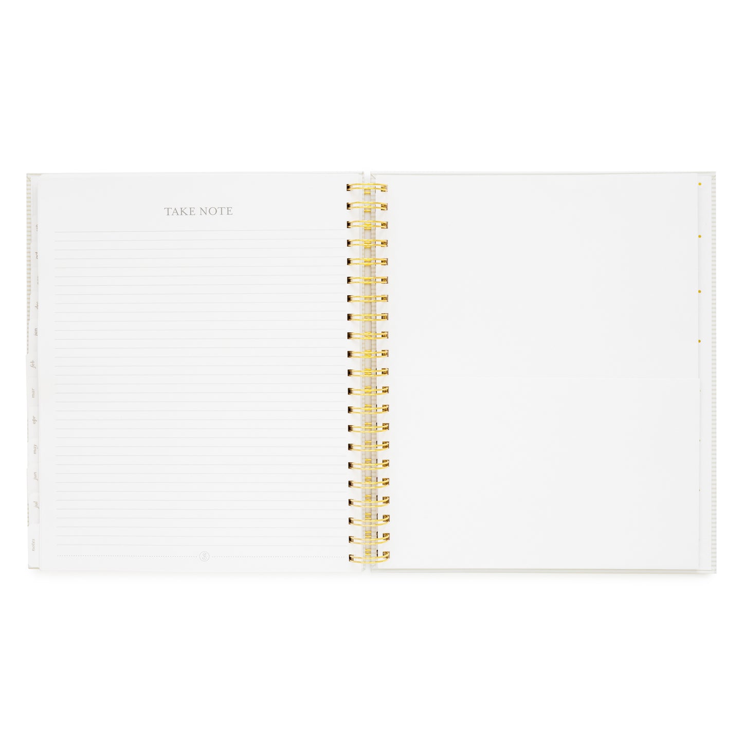 spiral planner open to notes page and folder pocket
