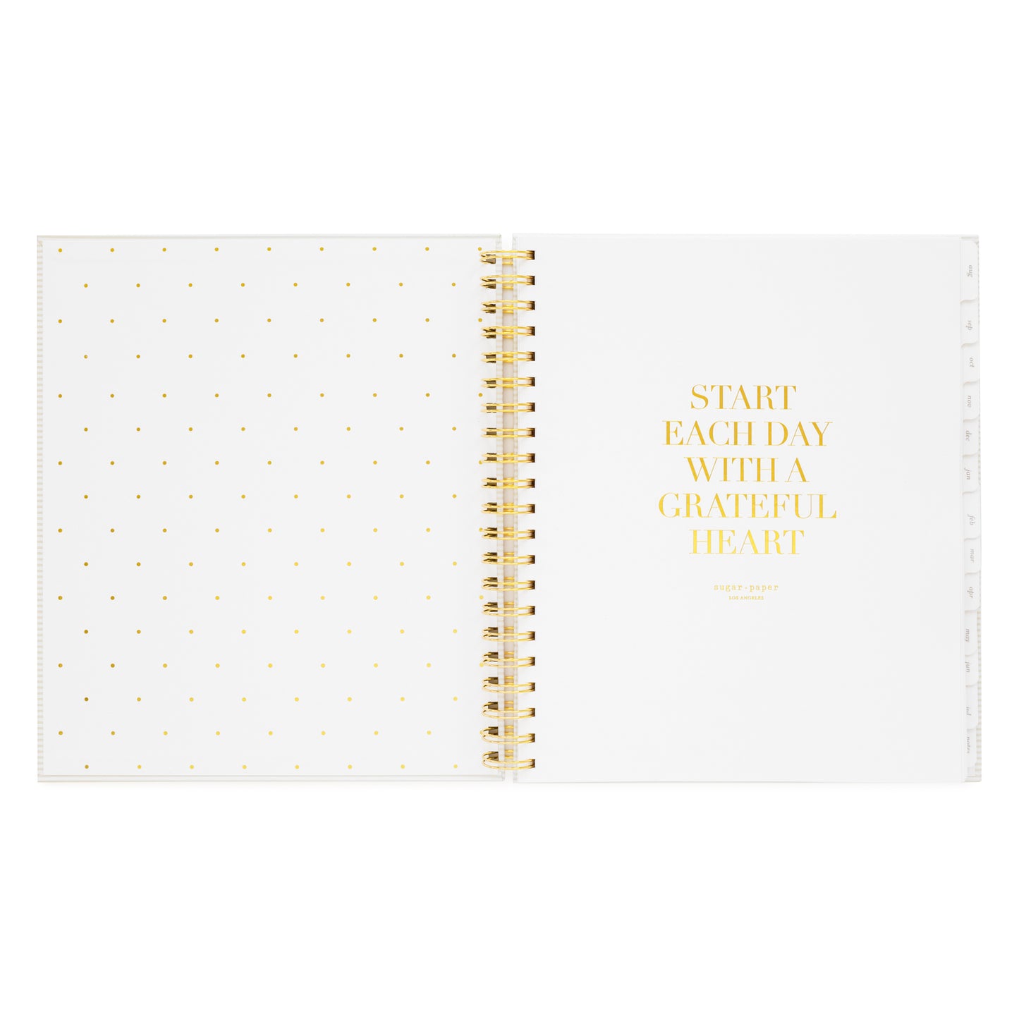 spiral planner open to cover page with start each day with a grateful heart quote