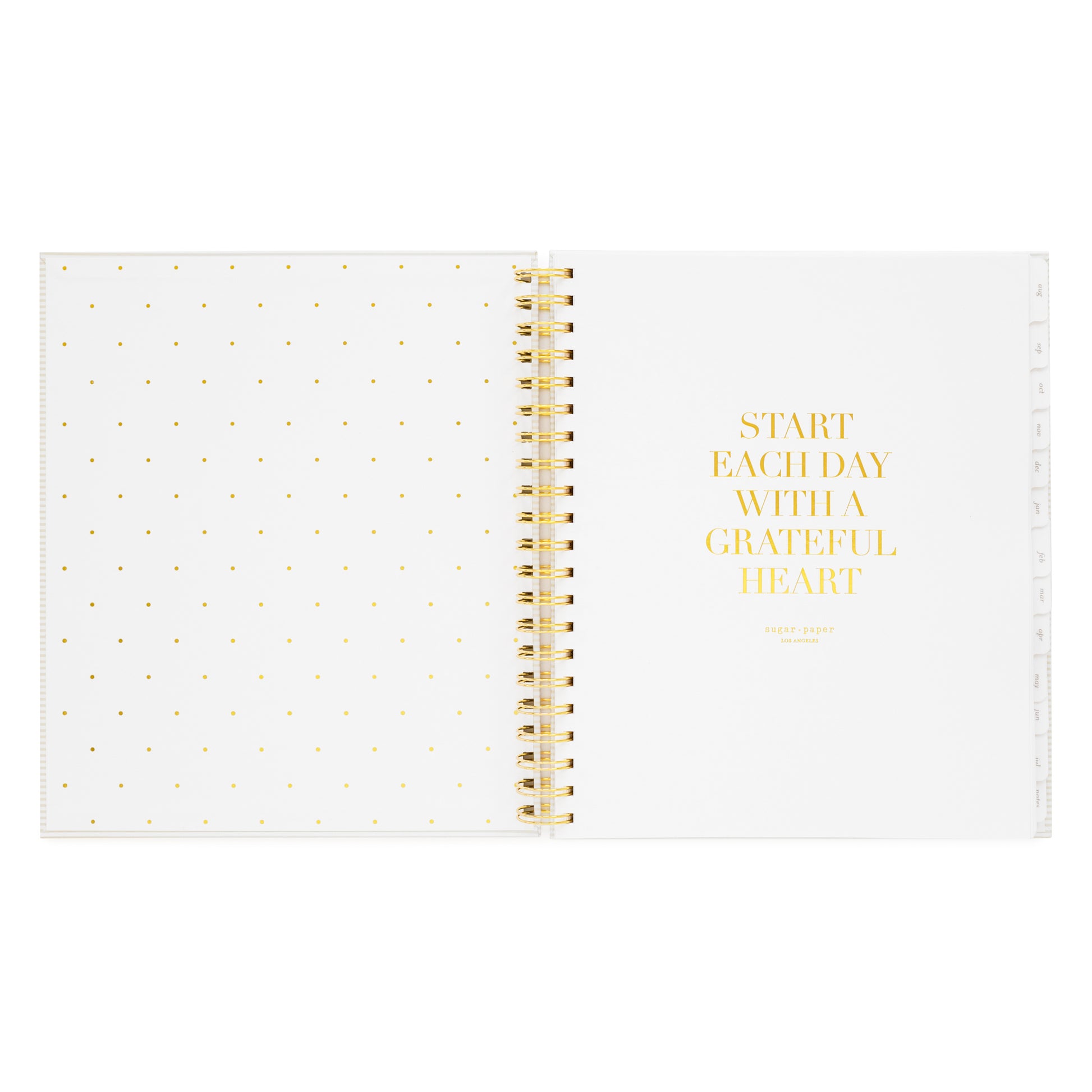 spiral planner open to cover page with start each day with a grateful heart quote