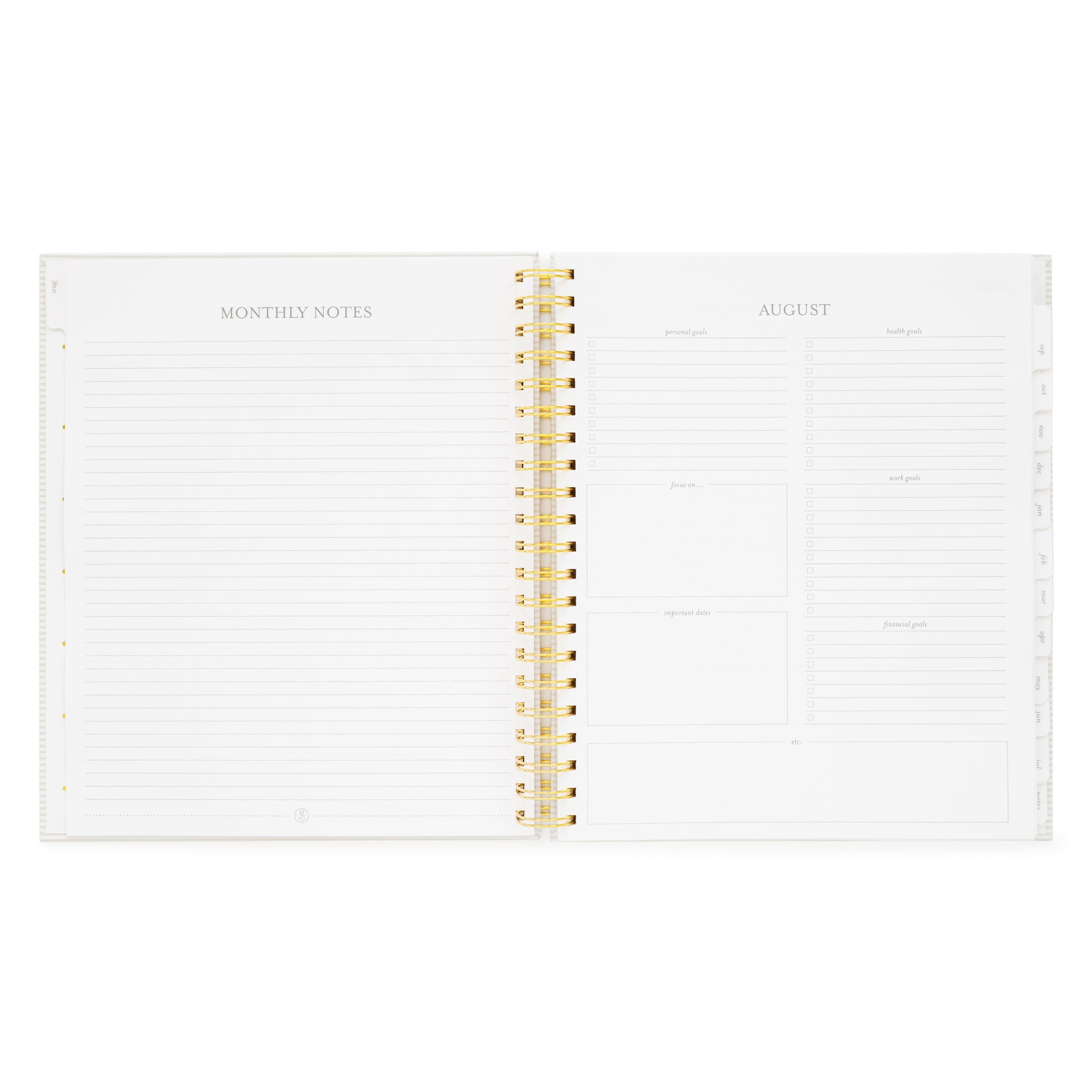 spiral planner open to monthly notes and goal setting pages