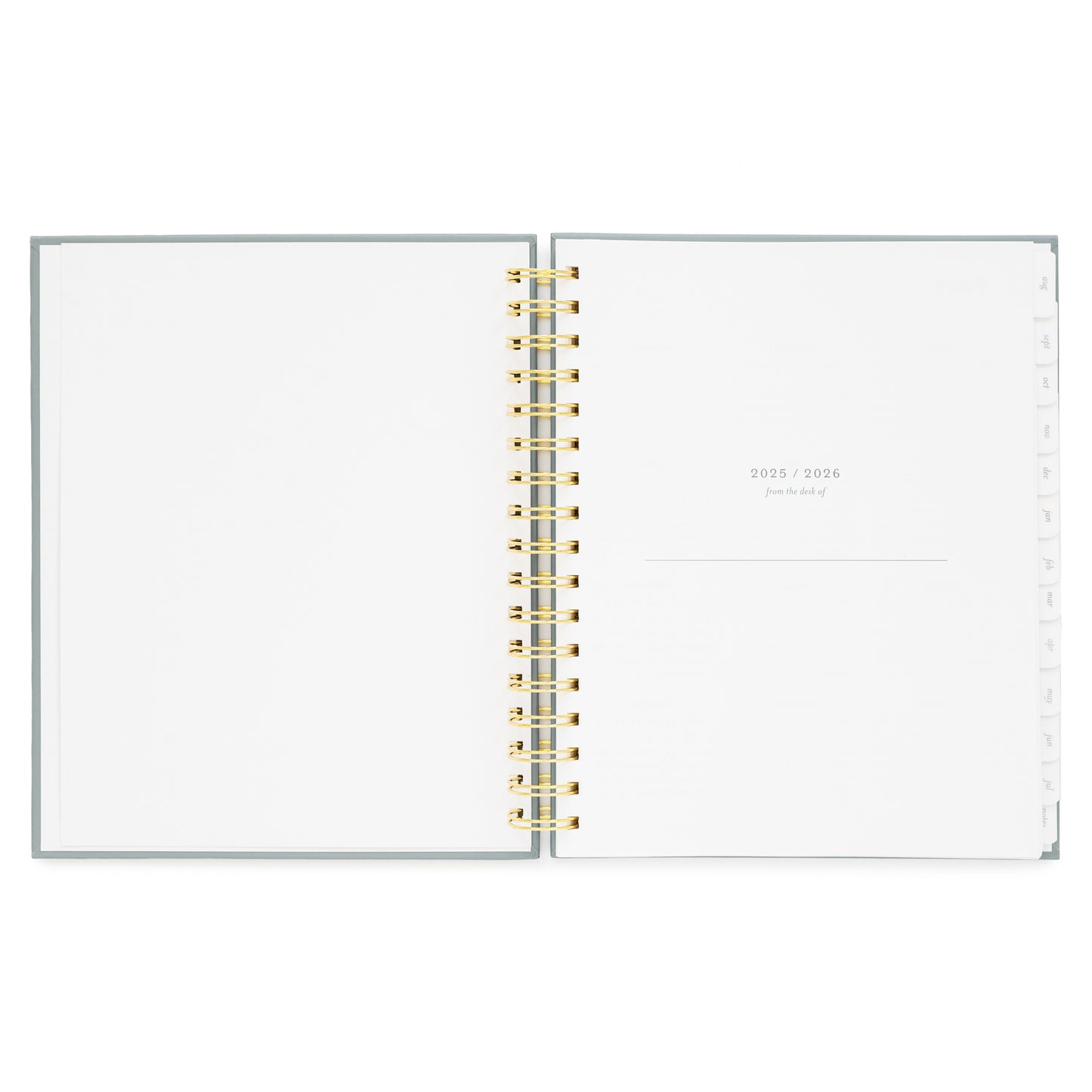 spiral planner open to 2025/2026 from the desk of page