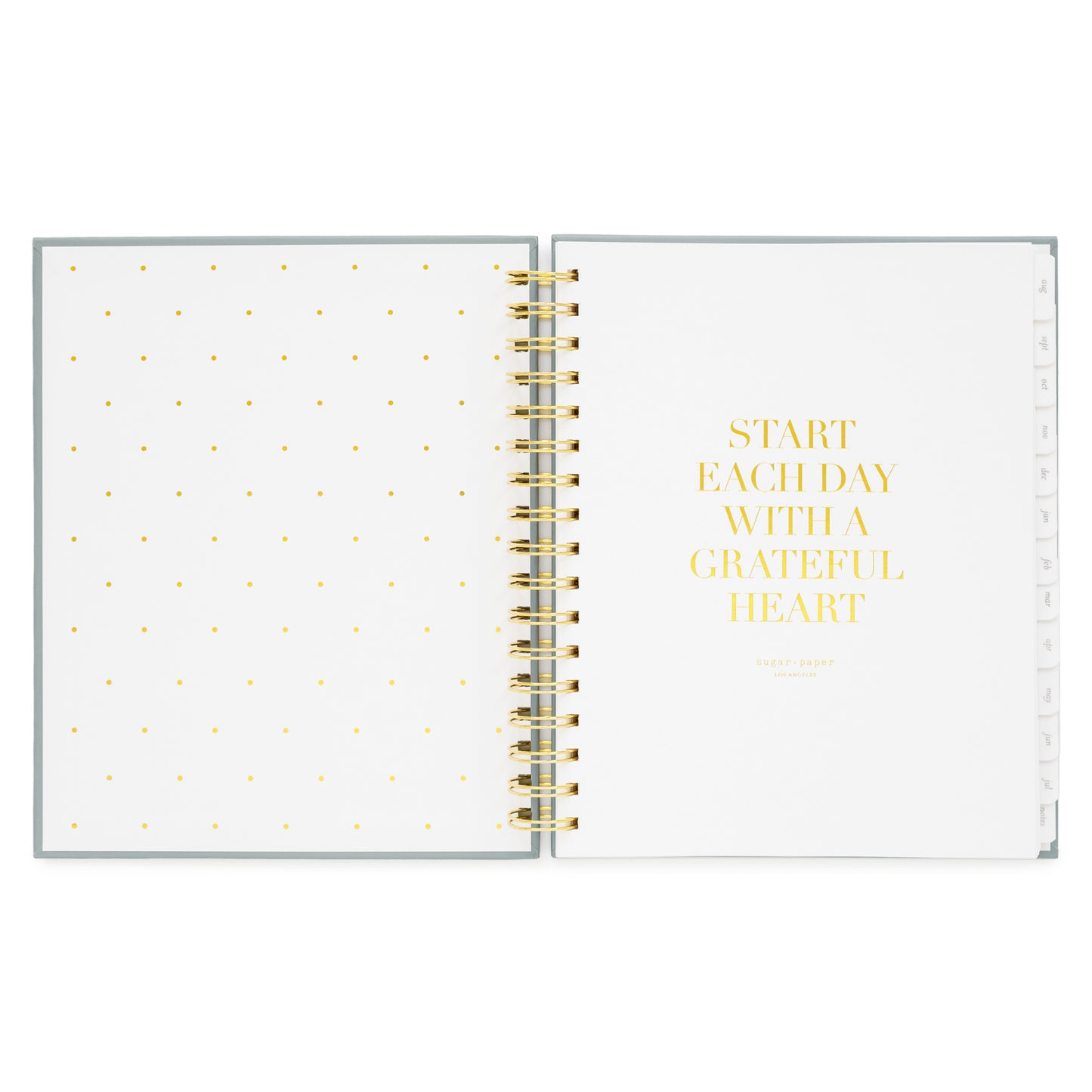 spiral planner open to cover page with start each day with a grateful heart quote
