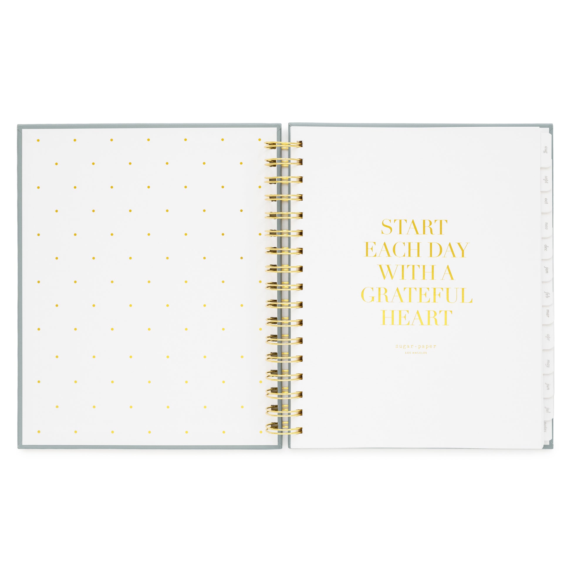 spiral planner open to cover page with start each day with a grateful heart quote