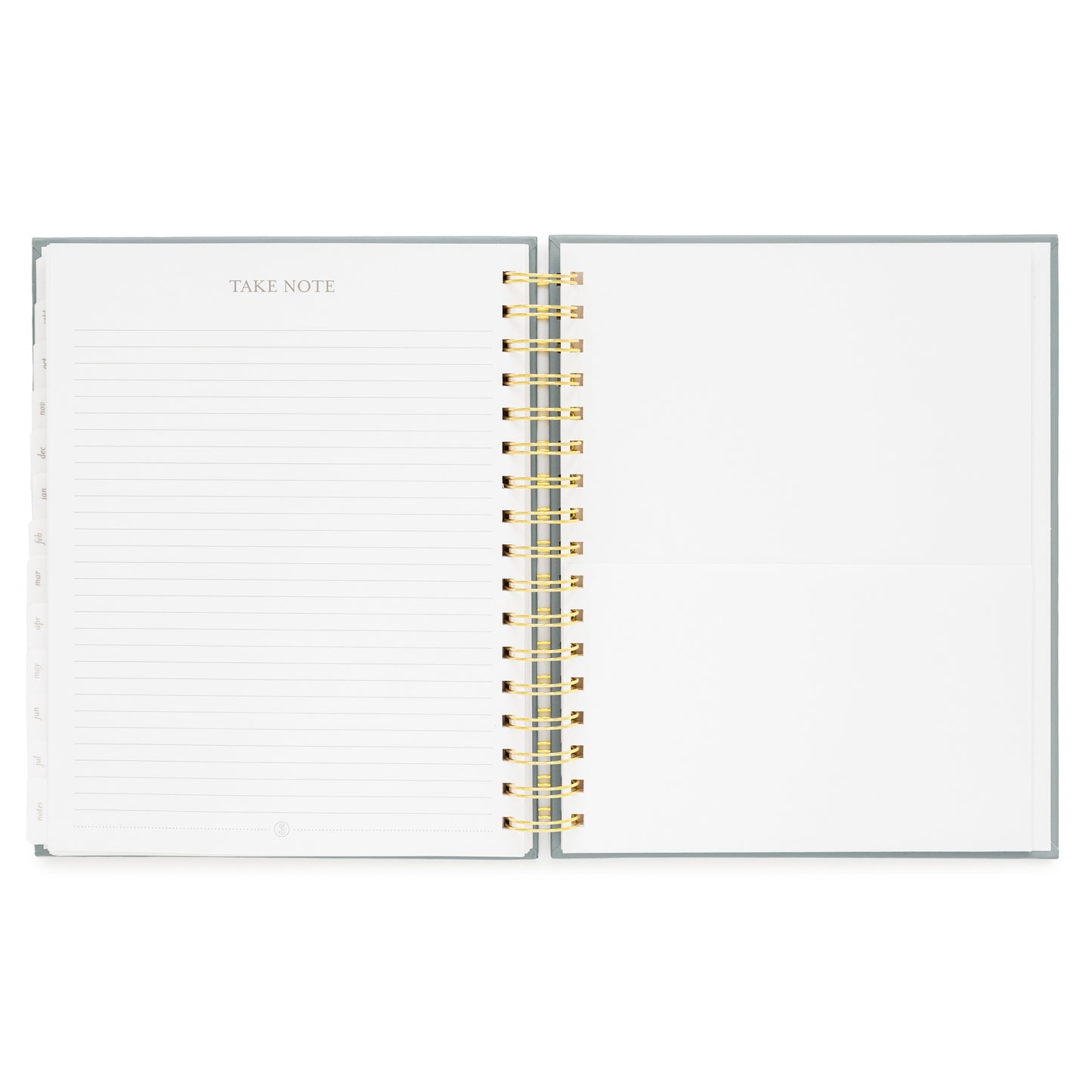 spiral planner open to notes page and folder pocket