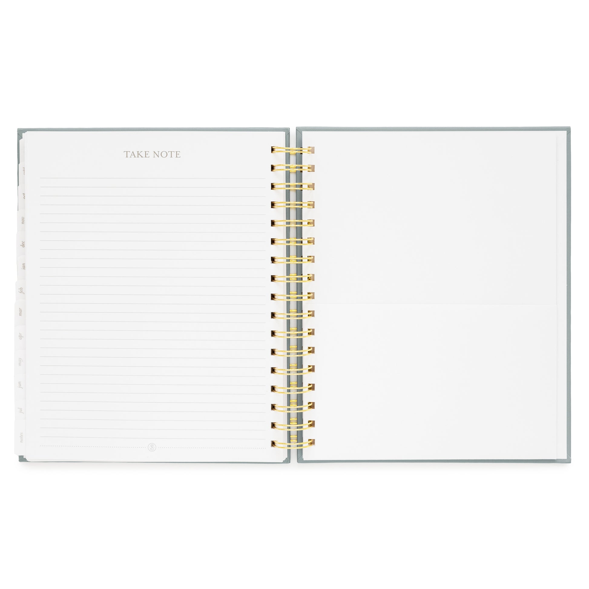 spiral planner open to notes page and folder pocket