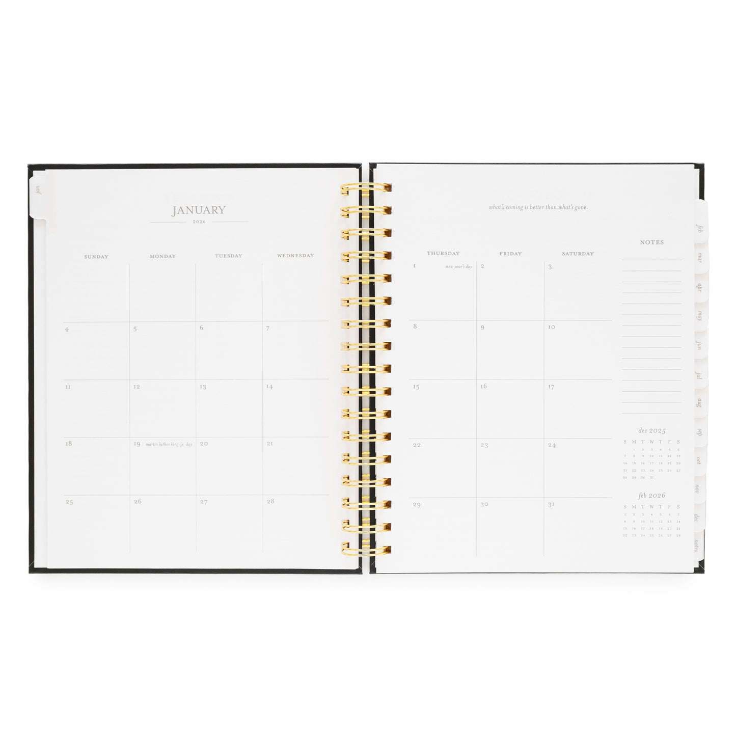 Open spiral planner showing a monthly layout for January 2026 with a gold spiral binding