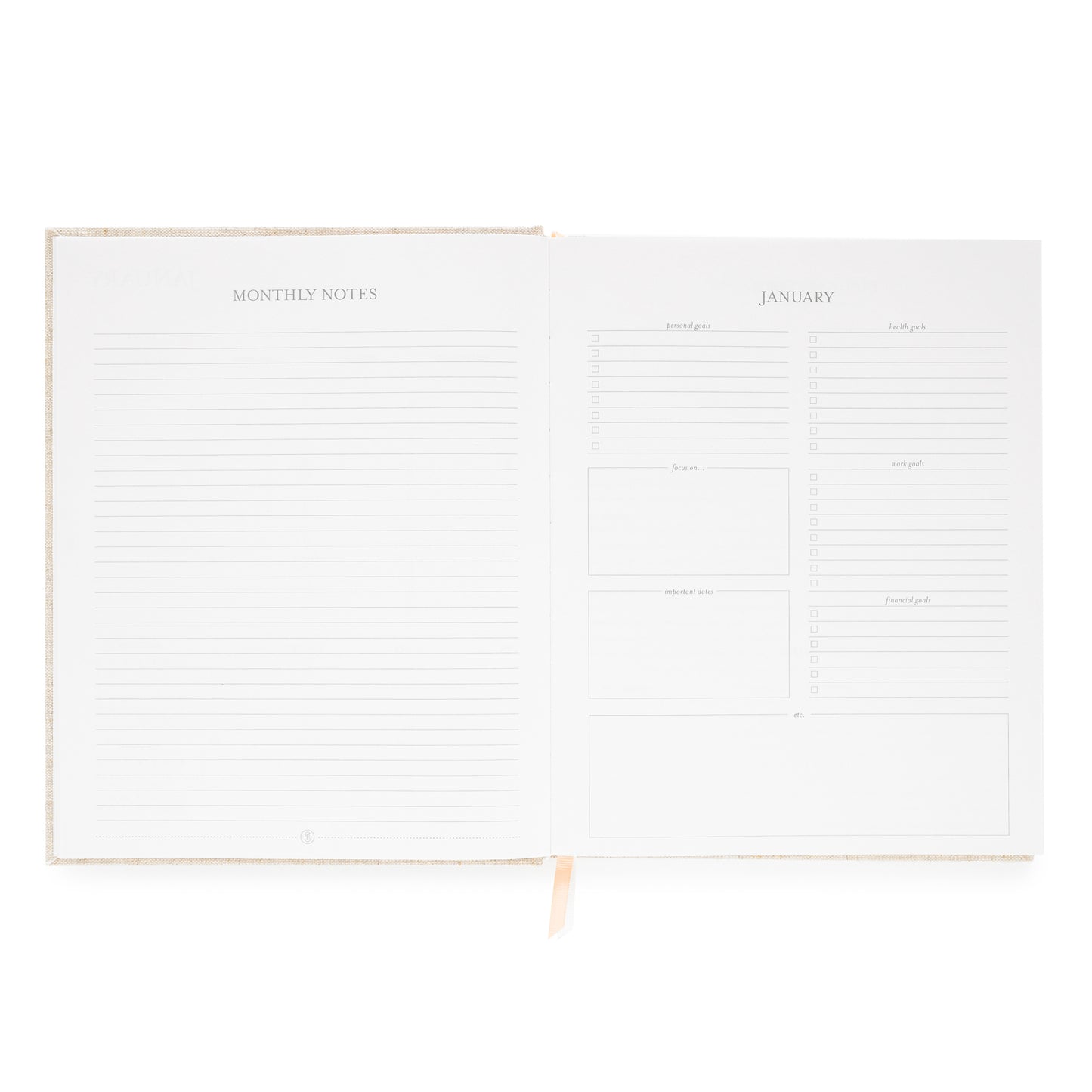 Interior of desk agenda with monthly notes and lined page and goals and prompts including personal, health, focus work, and financial goals and space for important dates and focus on