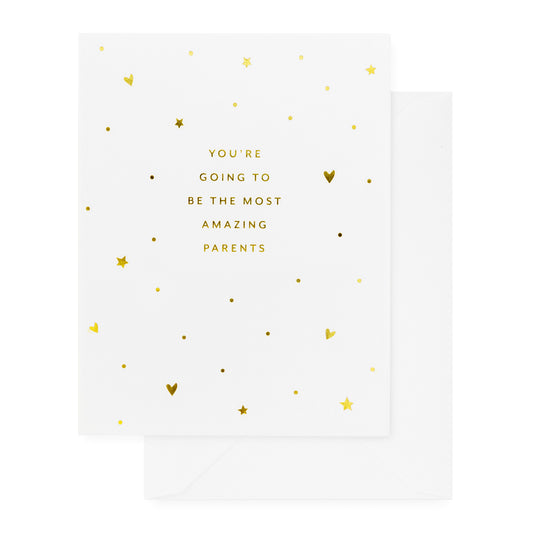 white card with gold foil text and heart pattern, white envelope