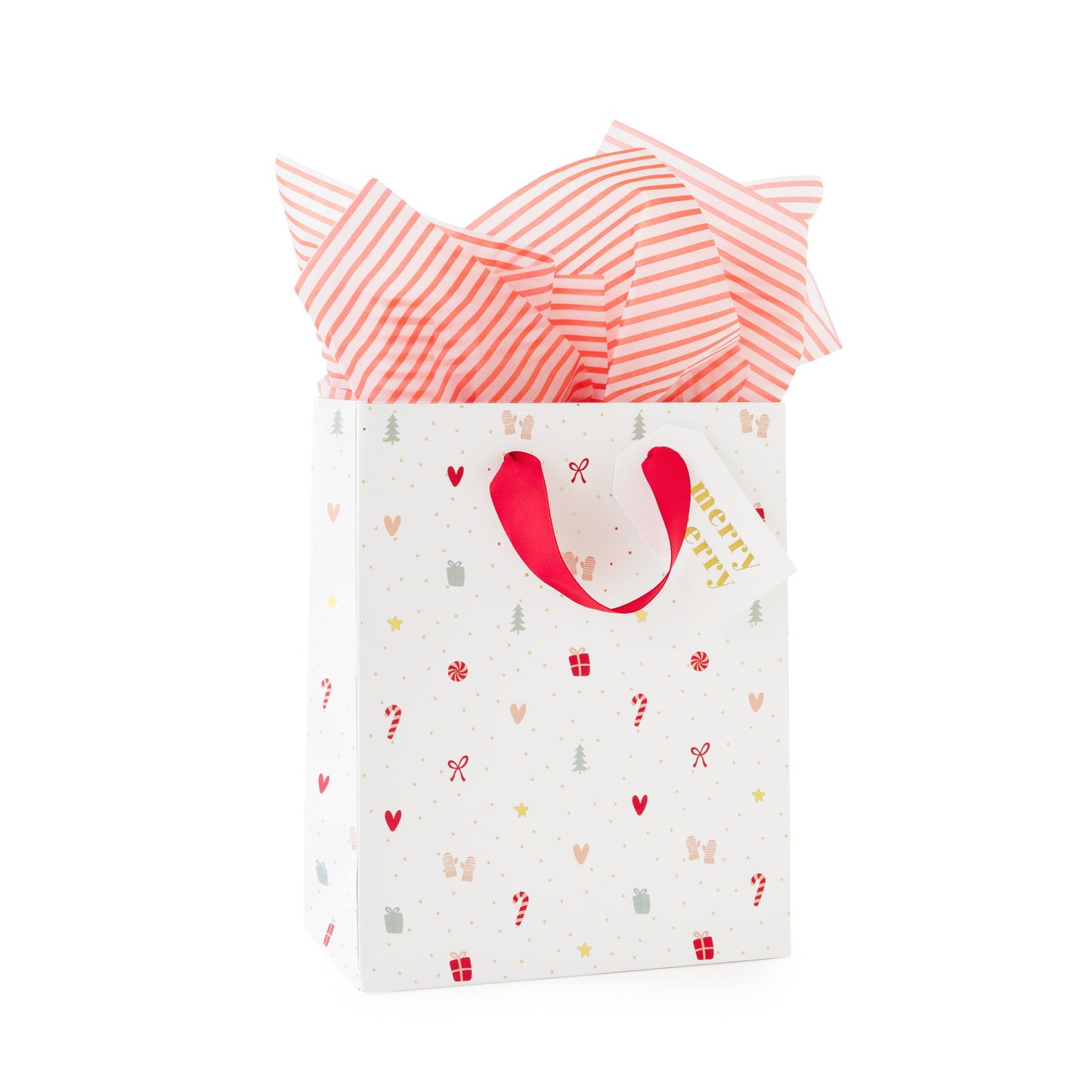 White gift bag with colorful icon pattern with a red grosgrain ribbon filled with red stripe tissue paper and gold foil 'merry merry' gift tag