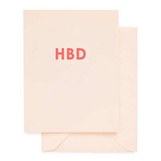 Pale pink birthday card printed with HBD in neon ink
