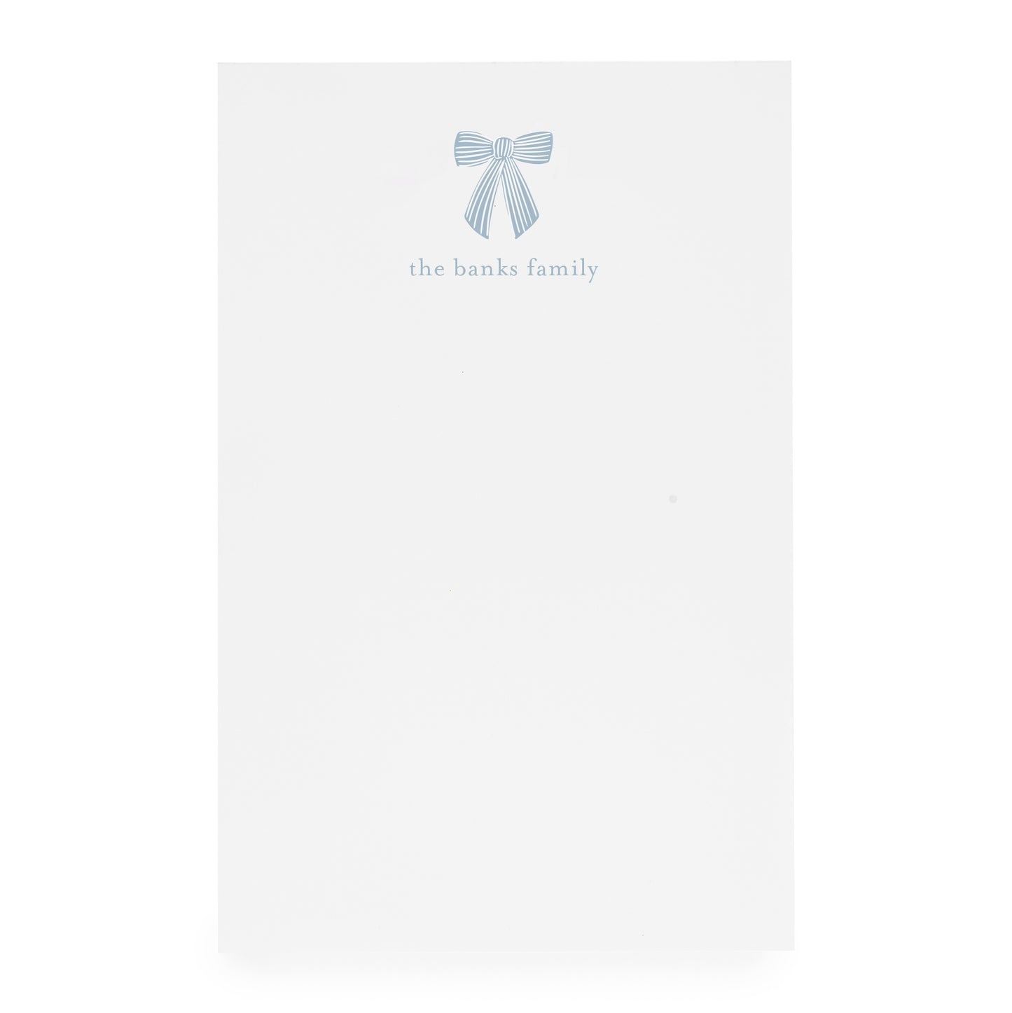 White paper with a blue bow design and 'the banks family' text on white paper
