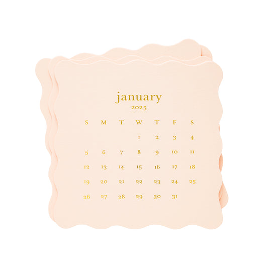 stack of pink scallop die cut desk calendar month cards