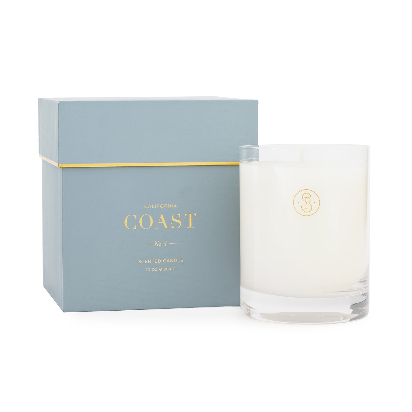 Blue boxed california coast candle with glass candle vessel next to it