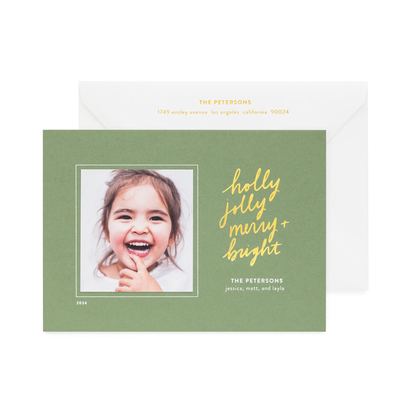 moss green holiday photo card printed with holly jolly merry bright in gold foil paired with a white envelope