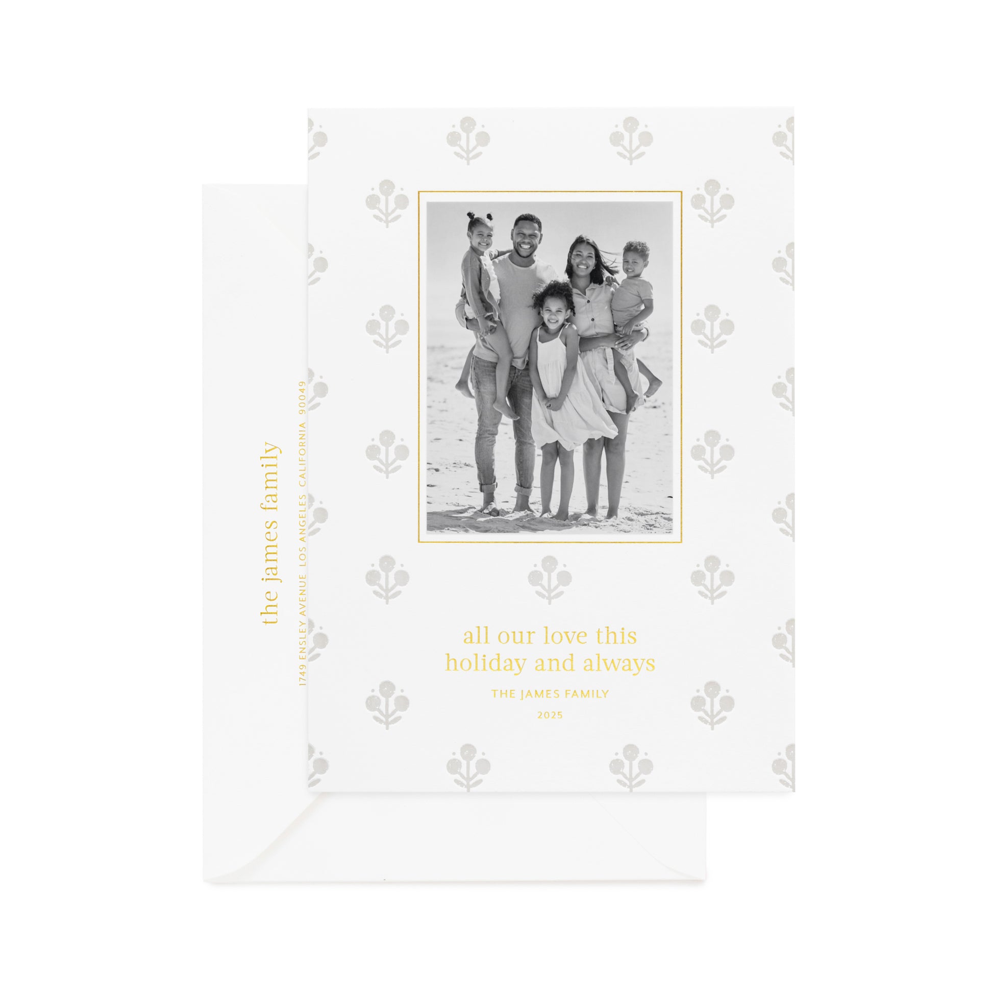 Grey floral pattern on white paper custom holiday card with a family photo in black and white printed in gold foil 'all our love this holiday and always' paired with a white envelope