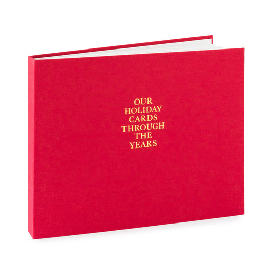 Red album with gold text 'Our Holiday Cards Through the Years'