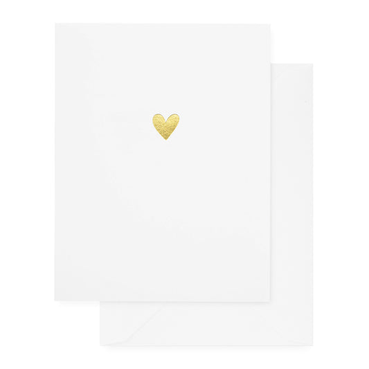 A simple white greeting card with a gold heart print in the center, accompanied by a white envelope.