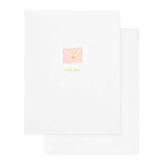 Miss you card with a pink envelope with gold heart