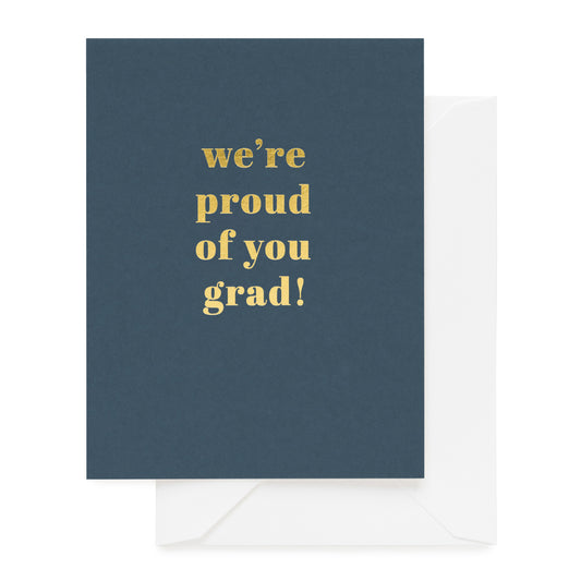 marina blue card with gold text we're proud of you grad