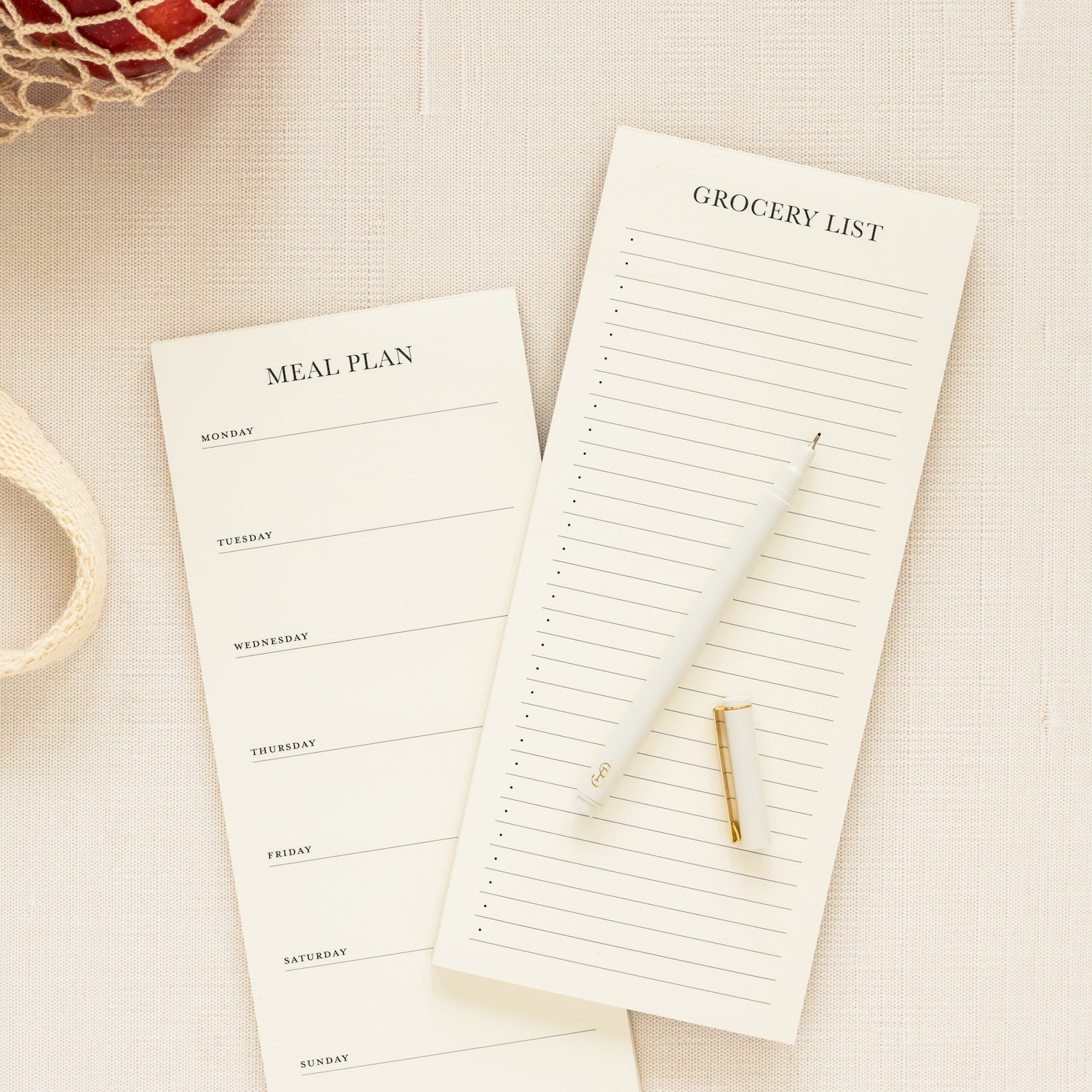 Grocery and meal list pads stacked with market bag