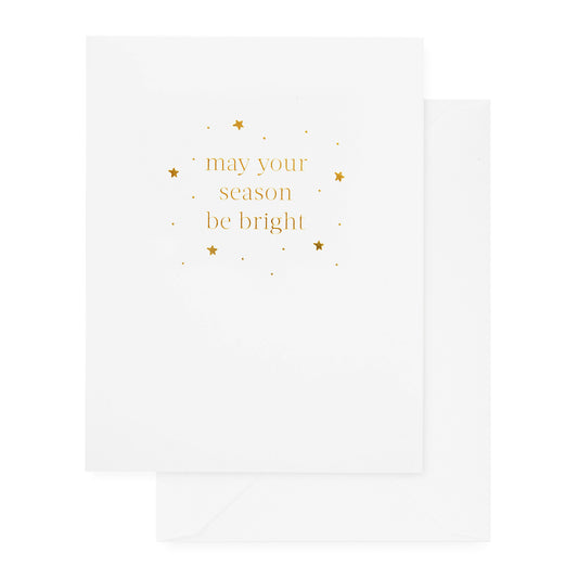 white holiday card with gold text and white envelope