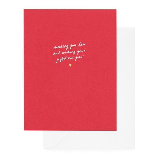 red holiday card with white and gold foil text details