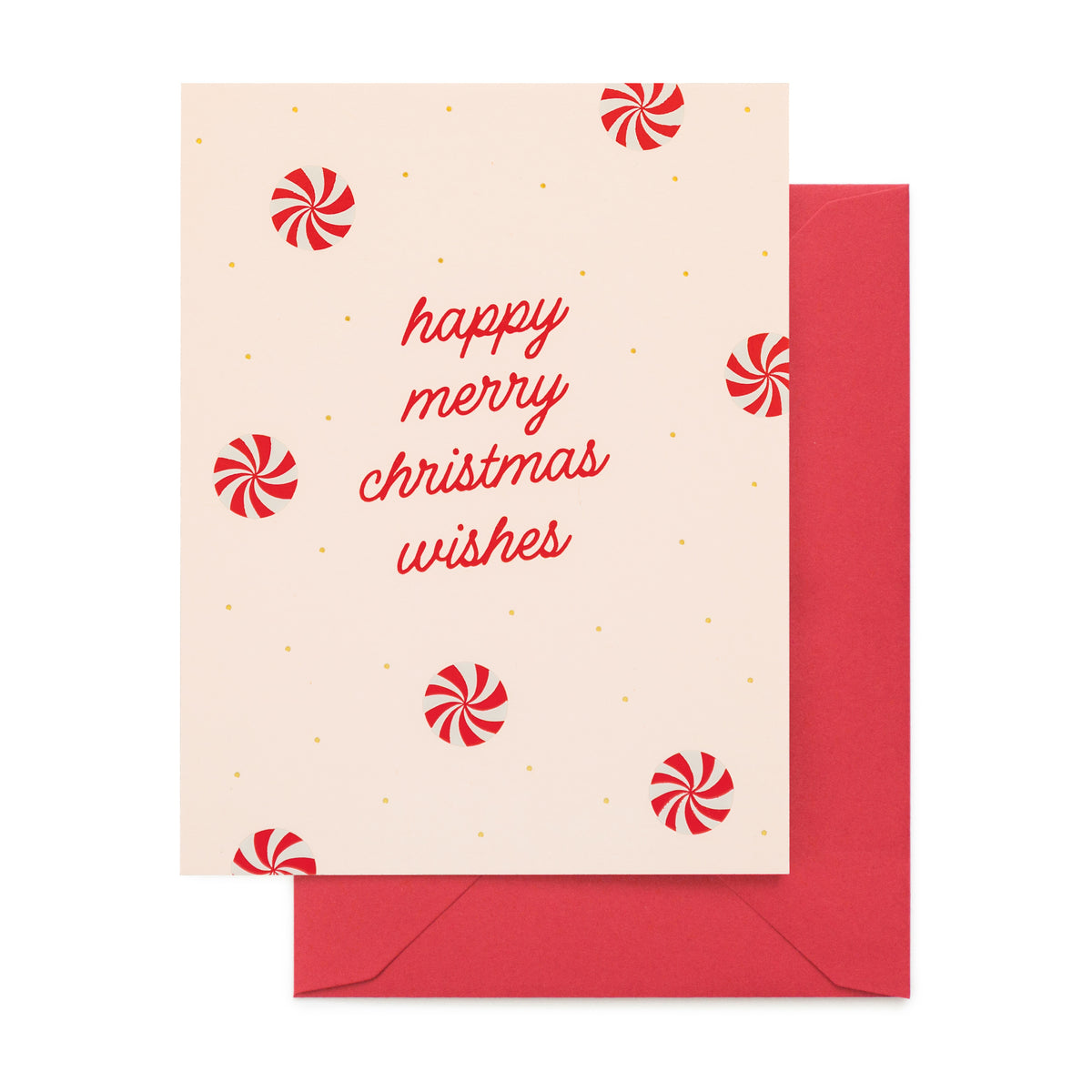 A Christmas greeting card with the words 'happy merry christmas wishes' in red script, decorated with red peppermint candies and small gold dots on pale pink paper, shown with a red envelope