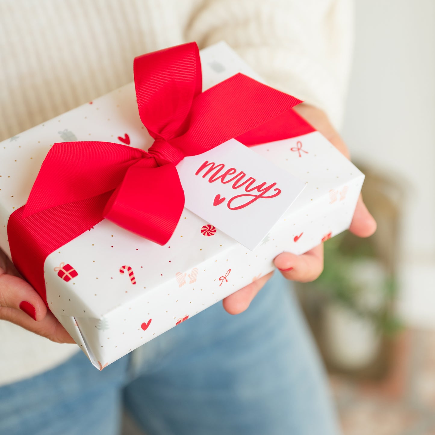 Santa's workshop holiday wrapped gift in hand