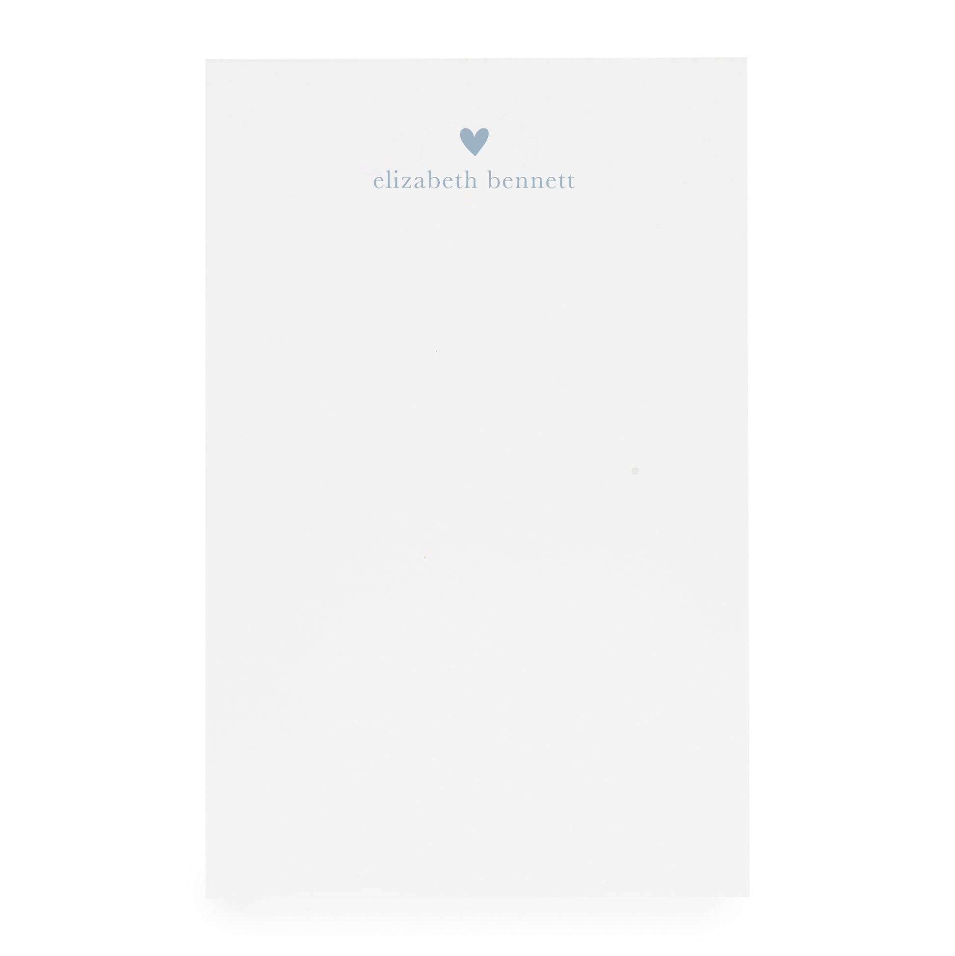 White notepad with heart and "elizabeth bennett" in blue