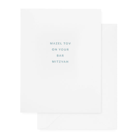 white bar mitzvah card with slate blue text and white envelope