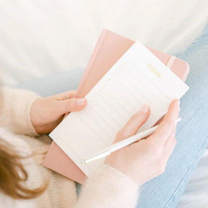 White and Gold Today pad in hand on pink journal