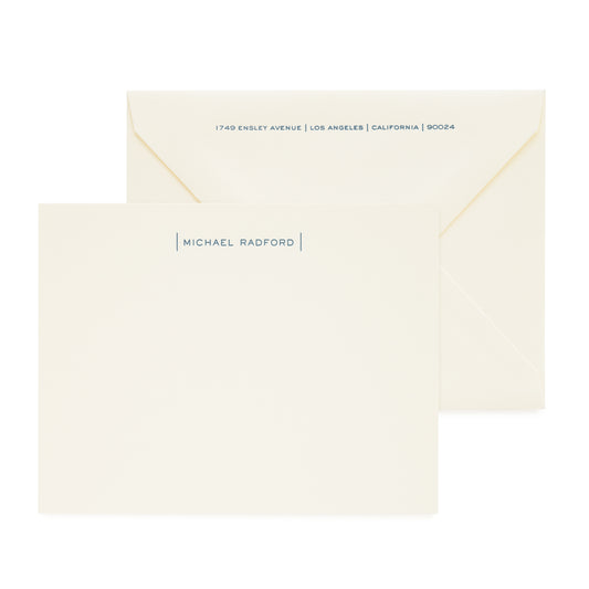 cream custom stationery card with navy letterpress ink and matching envelope