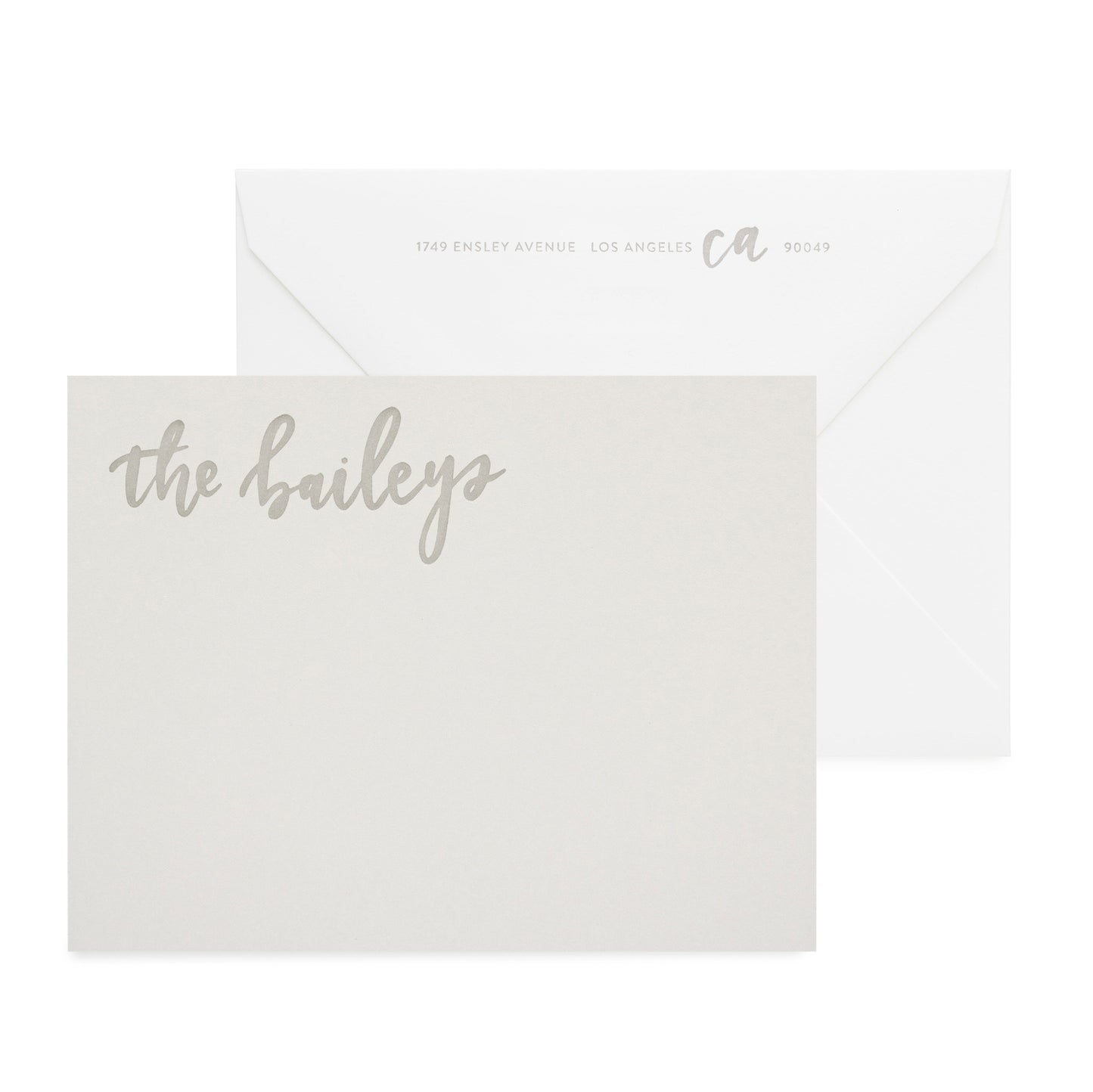 Grey notepad letterpress printed in warm grey ink with white envelope