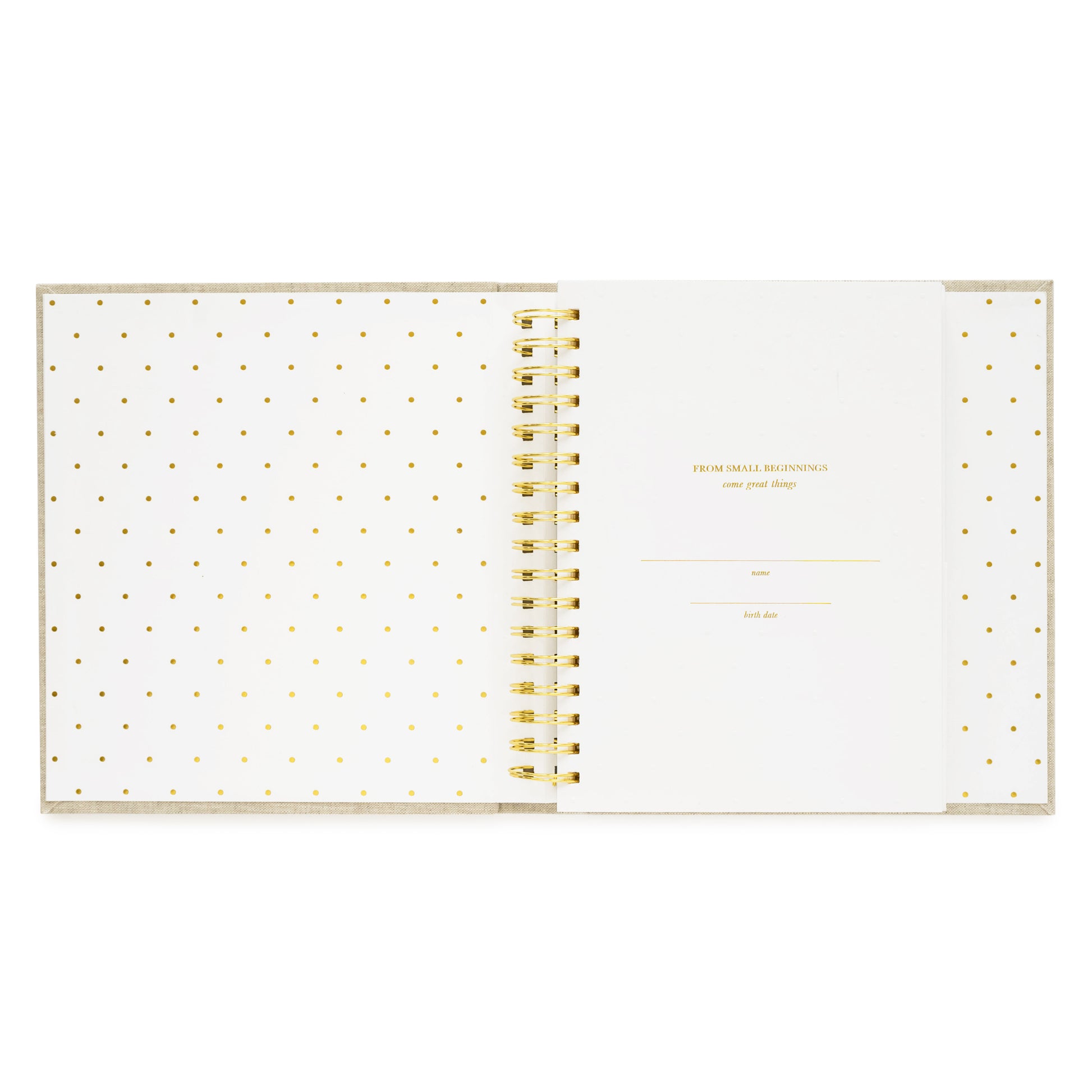 baby book open to cover page printed with from small beginnings come great things with baby's date and birth date