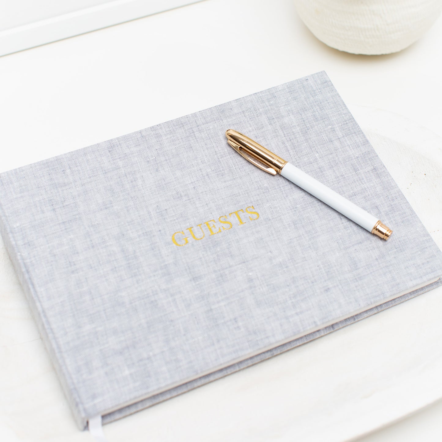 Grey guestbook cover foil stamped with guests