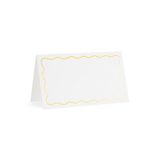 white tented place card with gold scallop border