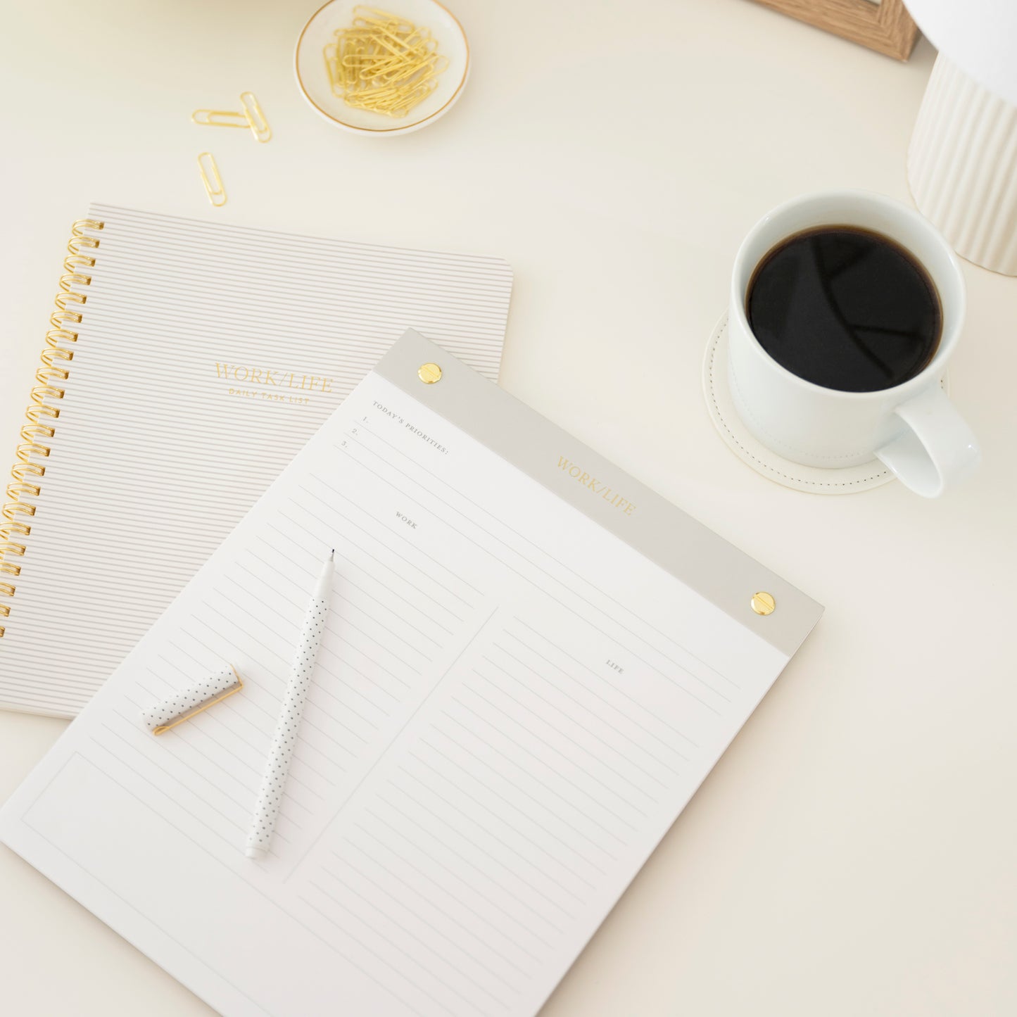 Gray work life notebook and pad on desk