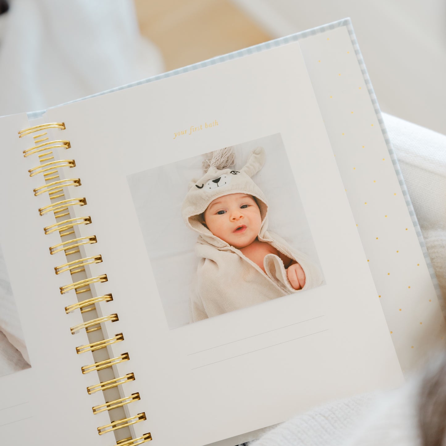baby book open to your first bath page with photo