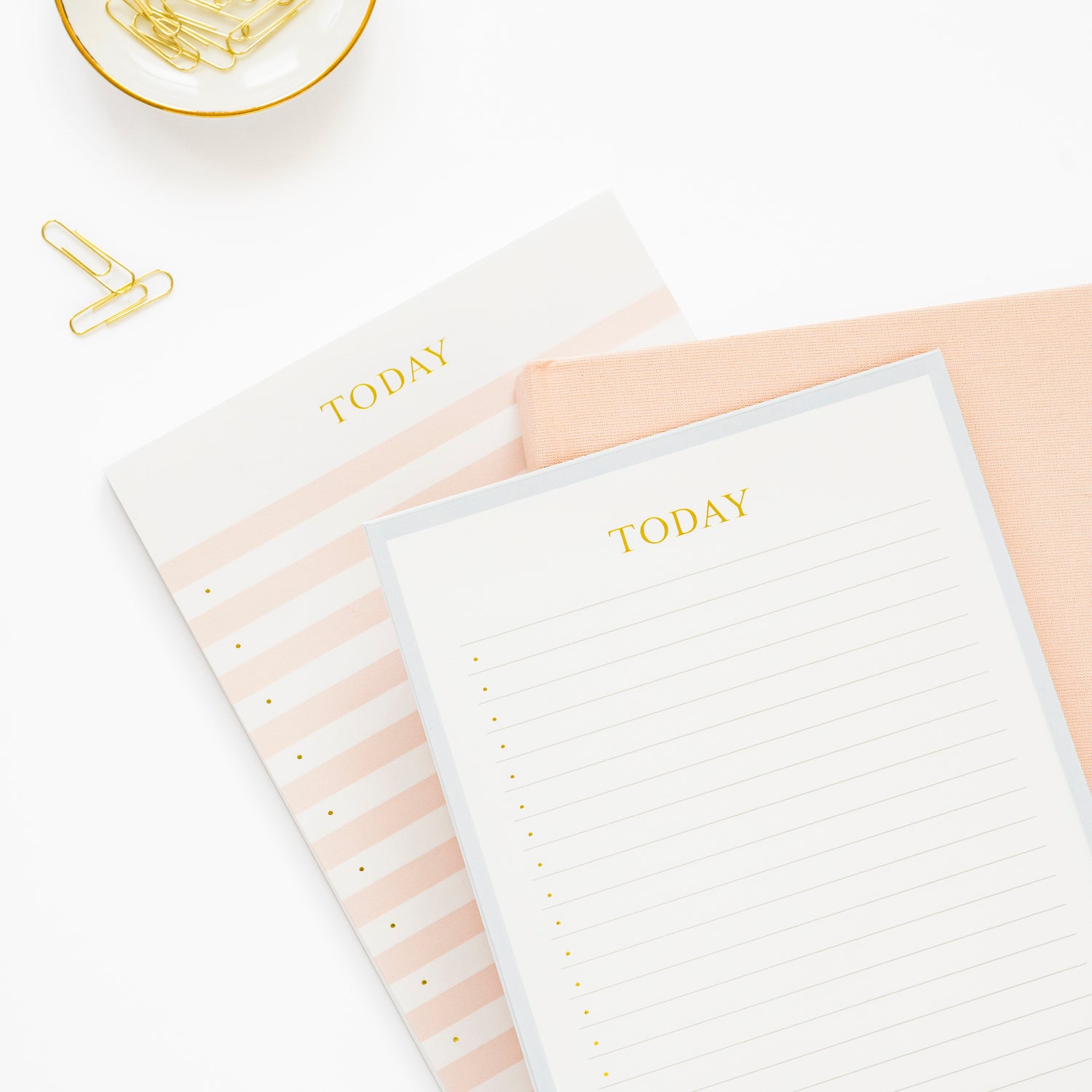 Stack of today blue, pink and white notepads