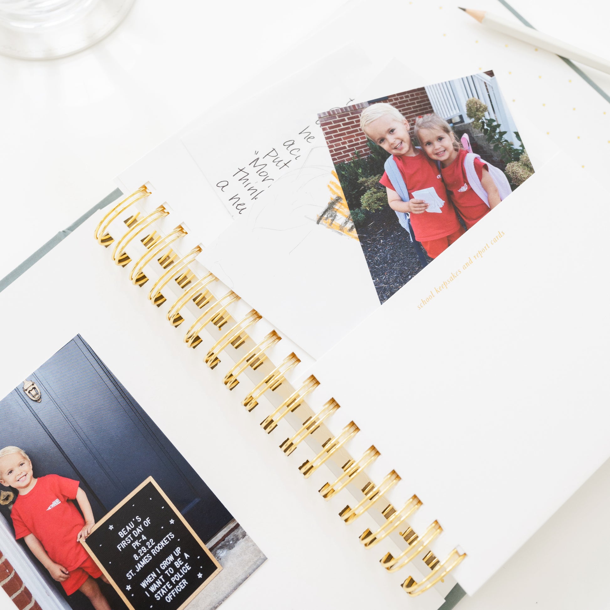 Pocket with a photo and notes tucked into the pocket that is printed with school keepsakes and report cards