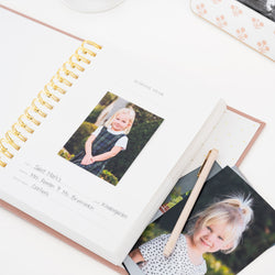 School years book over to kindergarten page with a photo and a space to note the school, grade, teachers and favorite subject