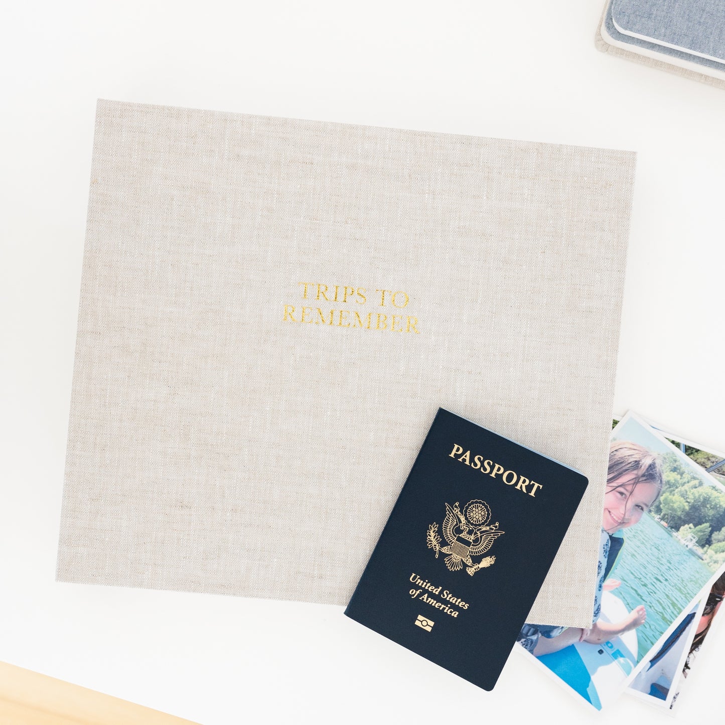 flax trips to remember book with passport on desk