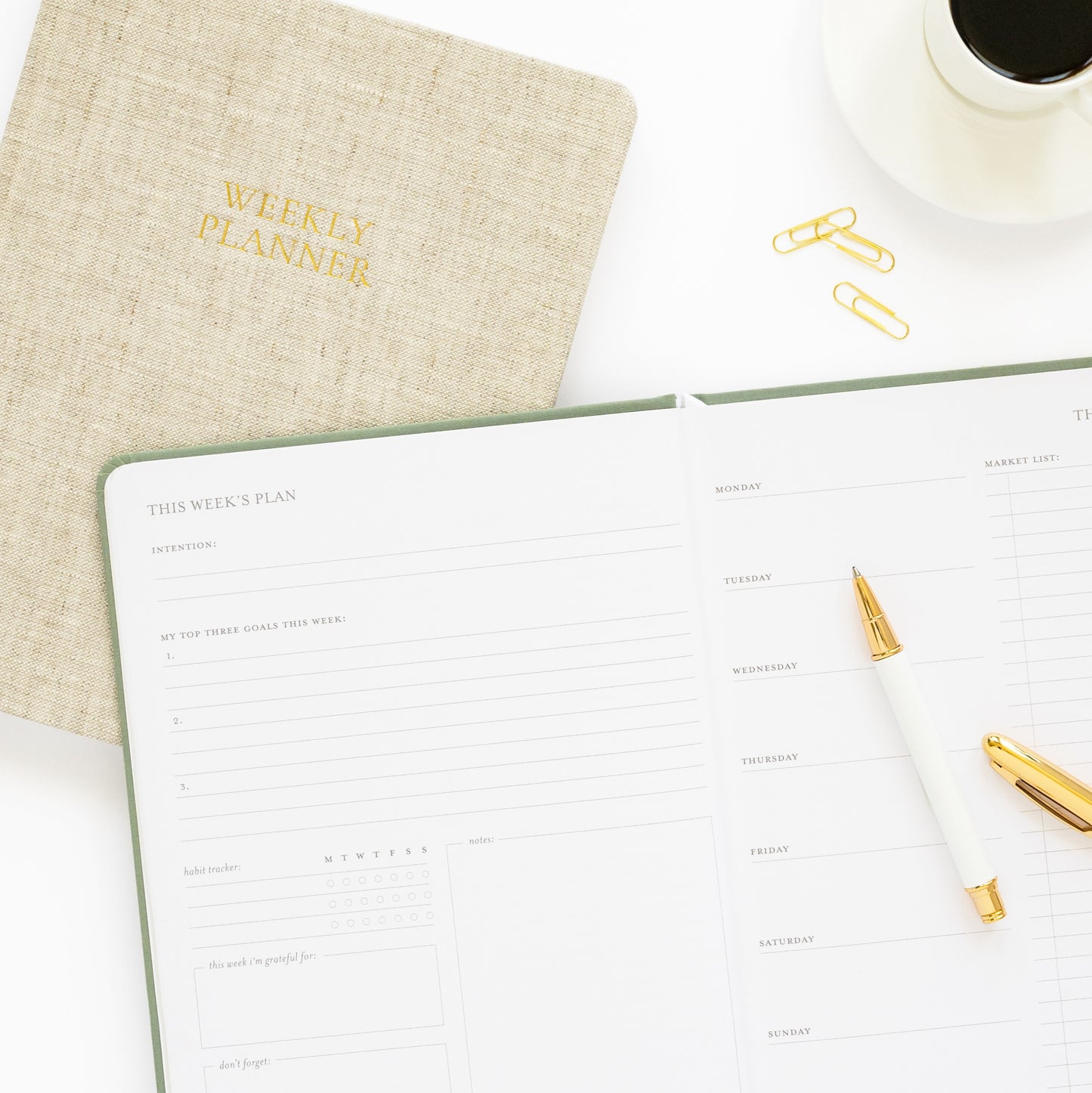 Weekly Planner cover with this week's plan spread on desk