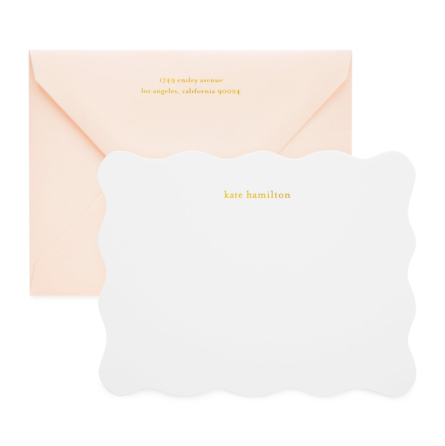 White scalloped custom stationery notecard foil printed with kate hamilton and paired with a pale pink envelope