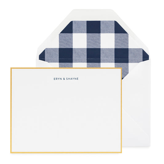 Navy blue eryn and shayne printed card with a gold border and navy blue check liner