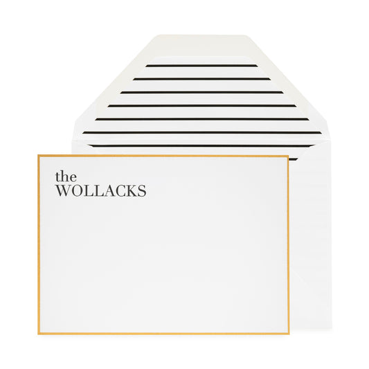 Black letterpress printed the wollacks custom stationery with a gold border and black stripe envelope liner