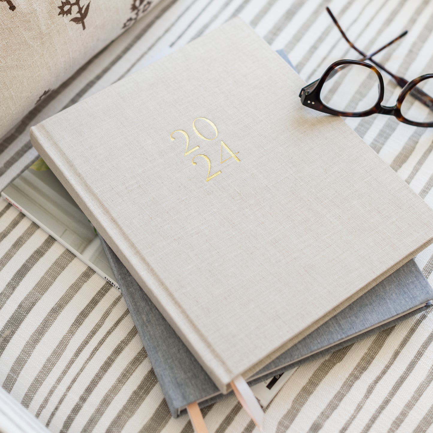 Stacked desk agendas on chair